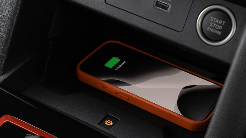 Close up of a phone on a wireless charger in a car