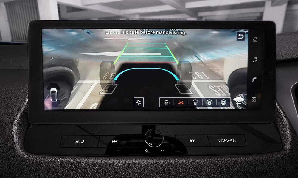 Close-up of a centre console screen showing a transparent hood on the car