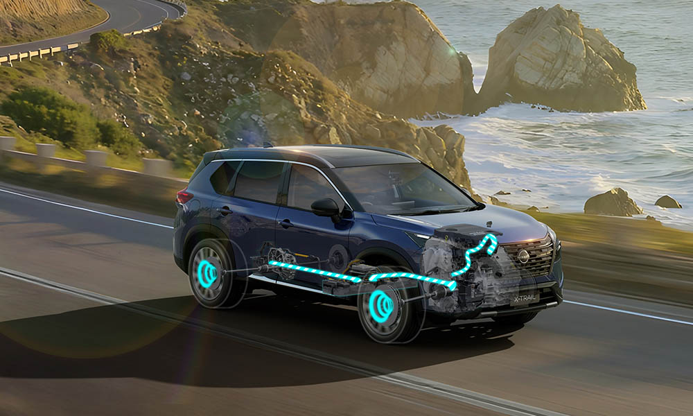 An X-Trail SUV driving on an ocean side road with it's hybrid powertrain x-ray highlighted